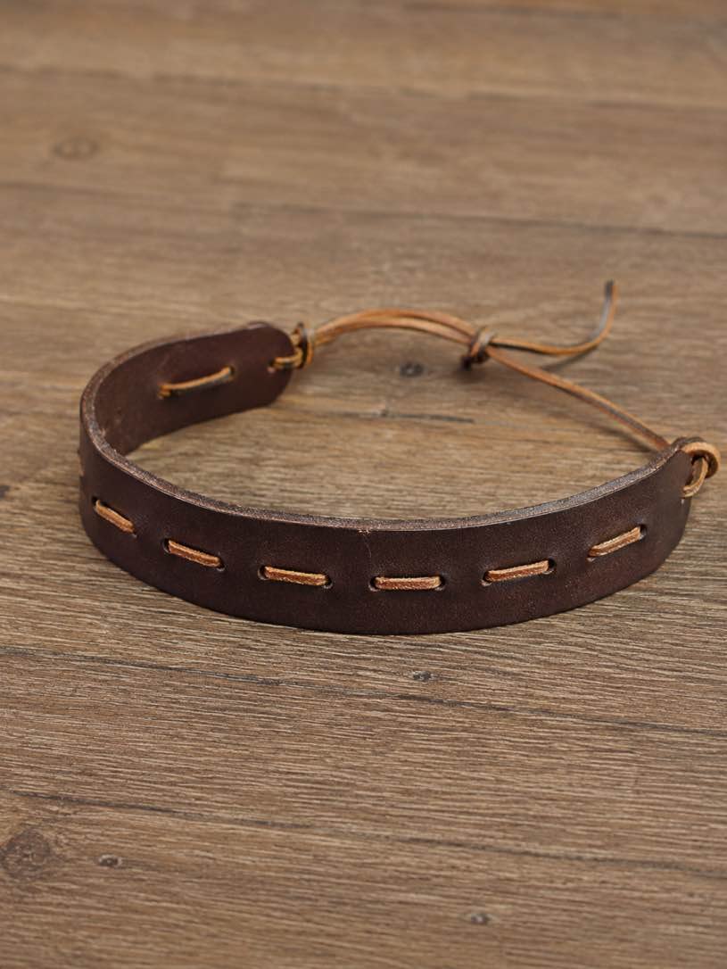 (case of 50) distressed brown leather, hand-laced detailing, and adjustable fit, this bracelet adds the perfect touch of rugged Western charm to any outfit. PM — photo 2